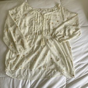 Long sleeve cram color see through blouse.